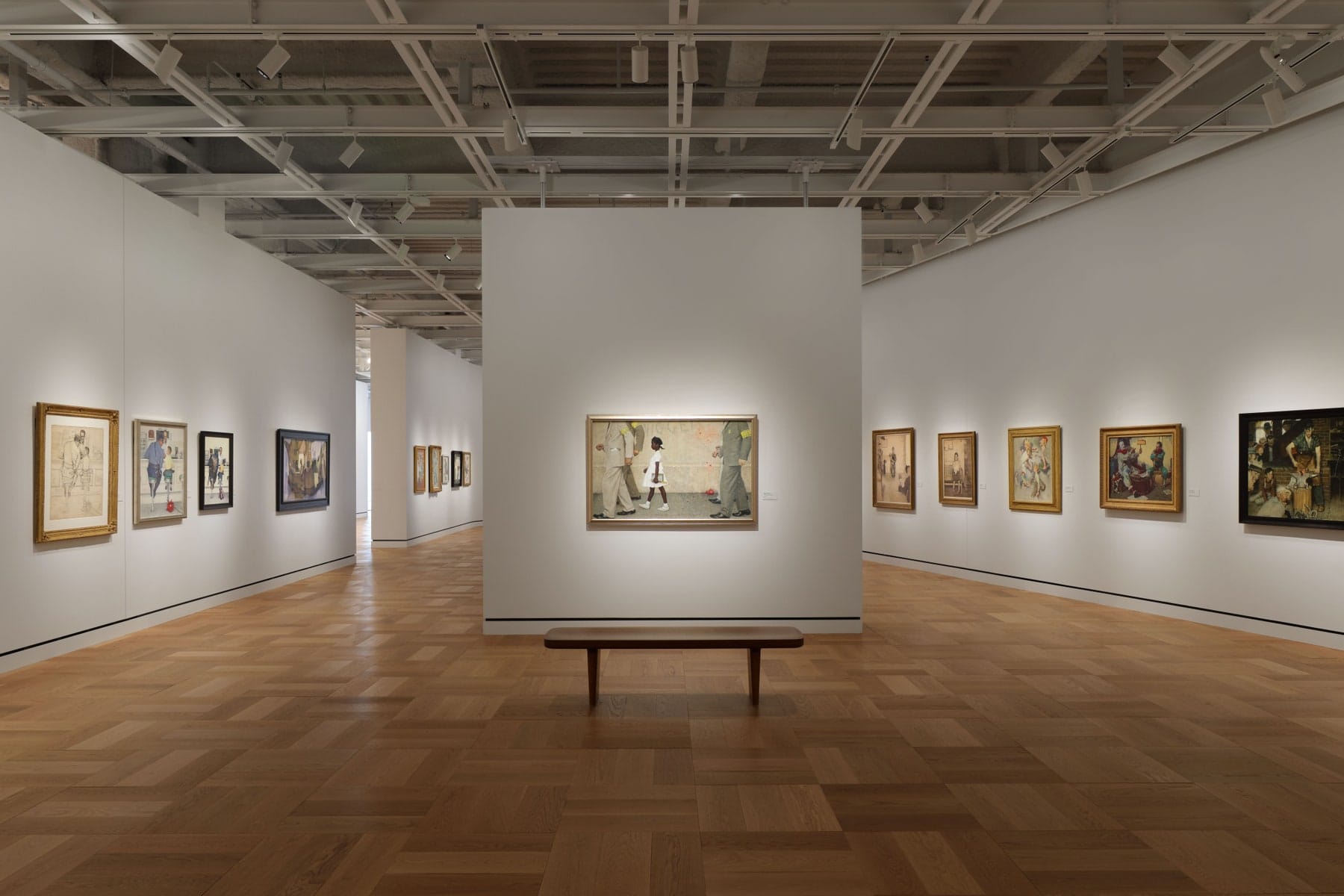 A gallery at the Lucas Museum of Narrative Art hung with paintings by Norman Rockwell