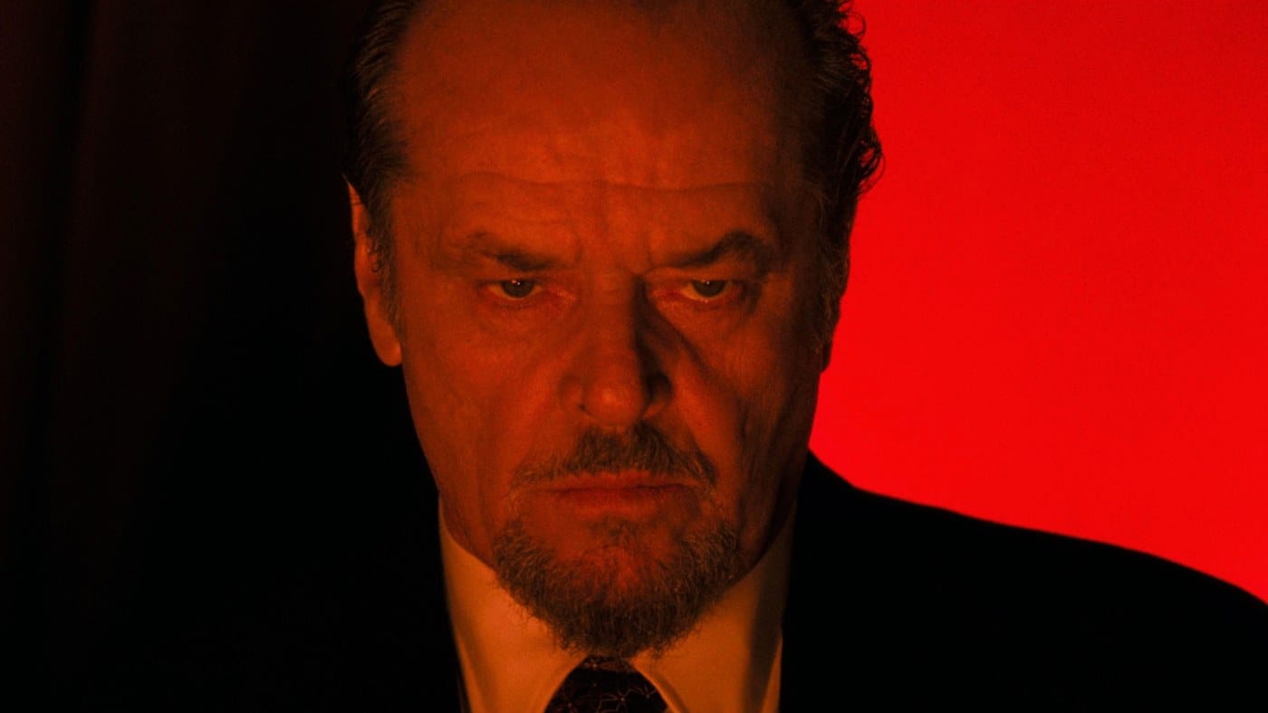 Jack Nicholson as Frank Costello, lit in red, in The Departed (2006)