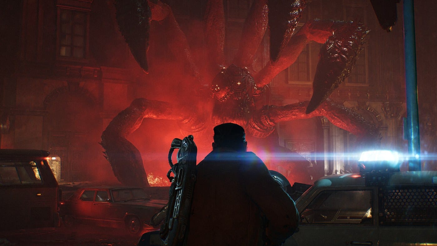 A Locust creature emerging in red light in a ruined street