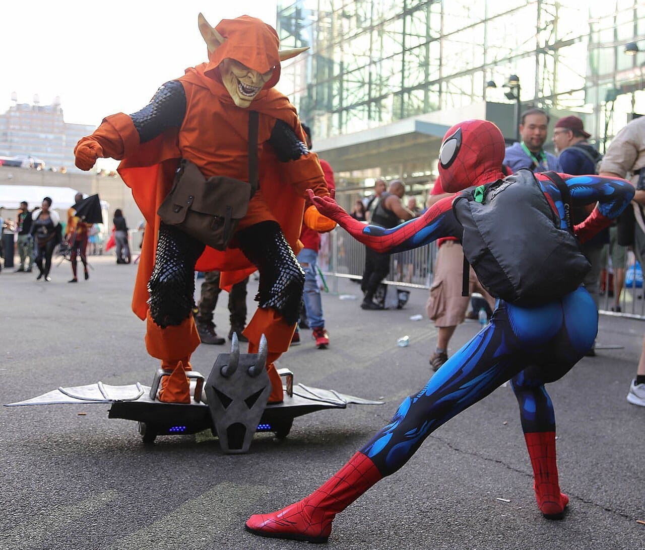 Spider-Man and Hobgoblin cosplayers staging a fight outside the Javits Center at New York Comic Con