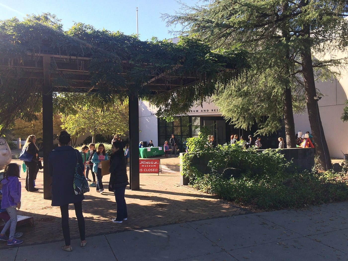 Visitors in the garden courtyard outside the Charles M. Schulz Museum