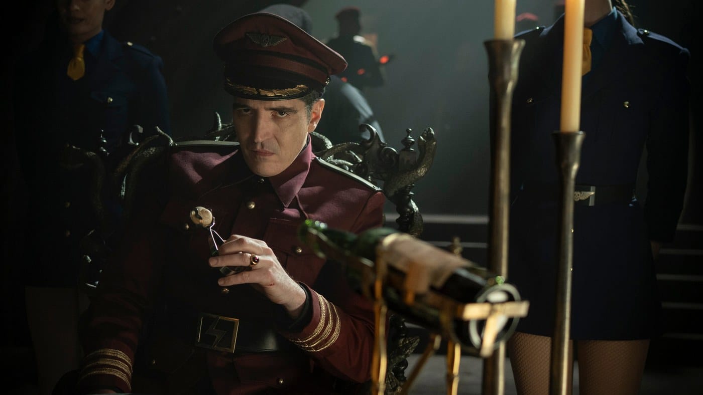 David Dastmalchian as M. Bison seated in a candlelit hall in Street Fighter (2026)