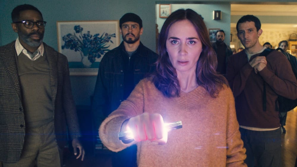 Emily Blunt holds a glowing object surrounded by her co-stars in Disclosure Day (2026)