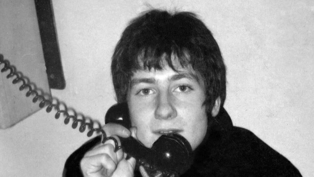 A young George Fenton on a backstage telephone at the Apollo Theatre, London, 1969