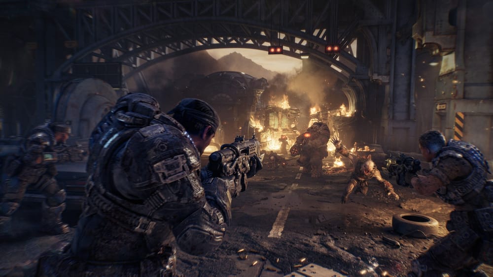 Marcus Fenix and COG soldiers fighting under a burning bridge in Kalona