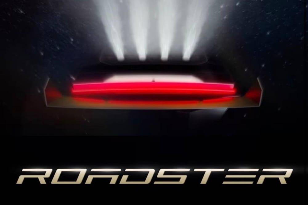 Teaser image of the Tesla Roadster with its rear thrusters firing, with the ROADSTER wordmark