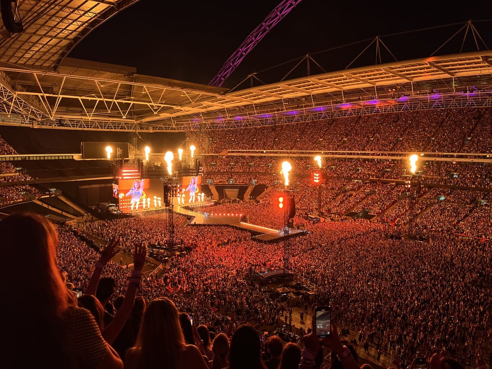 The Eras Tour at Wembley Stadium in London, with pyrotechnics and a full crowd
