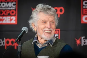 Tom Skerritt laughing at a microphone during an Alien panel at the Chicago Comic and Entertainment Expo in 2024