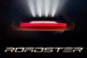 Teaser image of the Tesla Roadster with its rear thrusters firing, with the ROADSTER wordmark