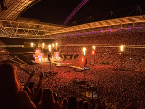 The Eras Tour at Wembley Stadium in London, with pyrotechnics and a full crowd